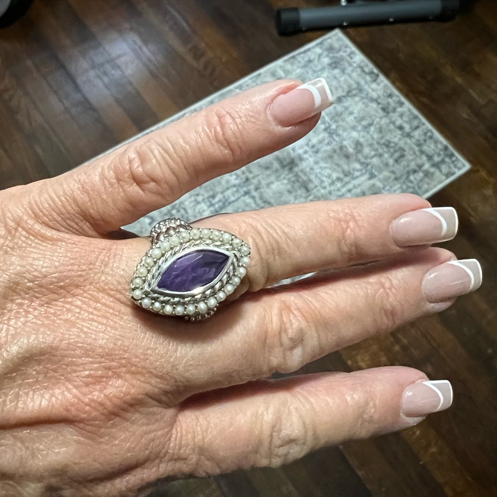 Amethyst ring set in sterling silver with pearl accents.